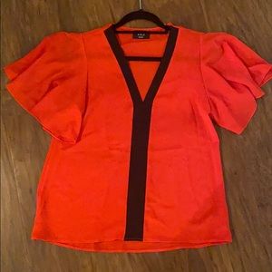 Red and black Vici top. Size Small.